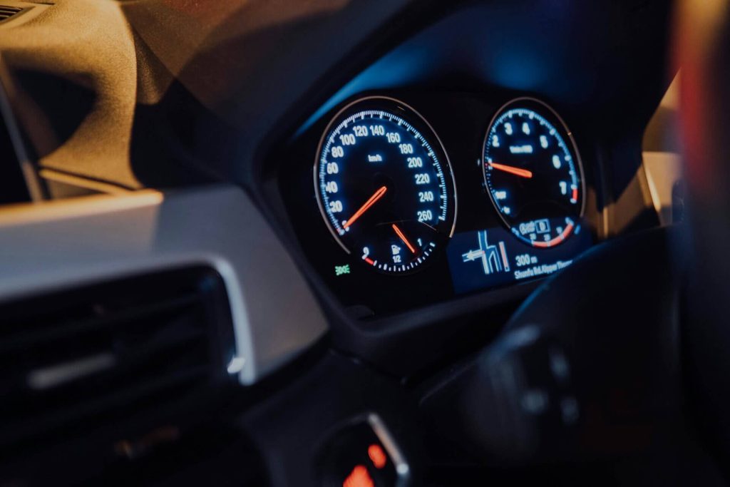 lighted car dashboard at night