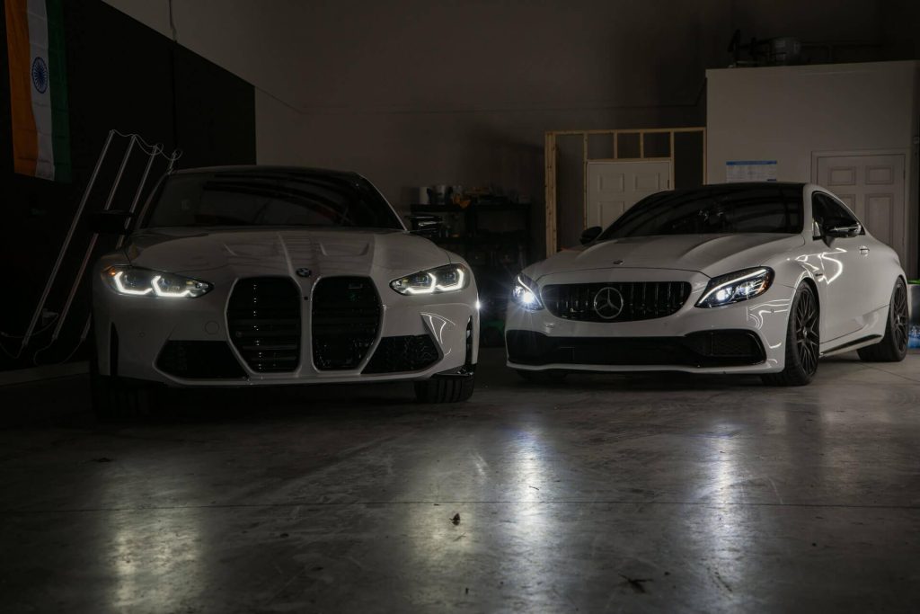 bmw and mercedes in garage